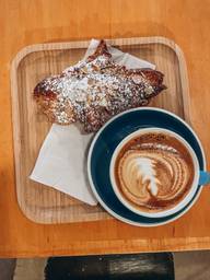 Almond croissant with cappuccino 