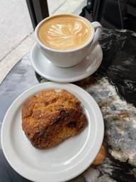 Getting ready for work at Humble Lion. Latte and scone going down smooth. 